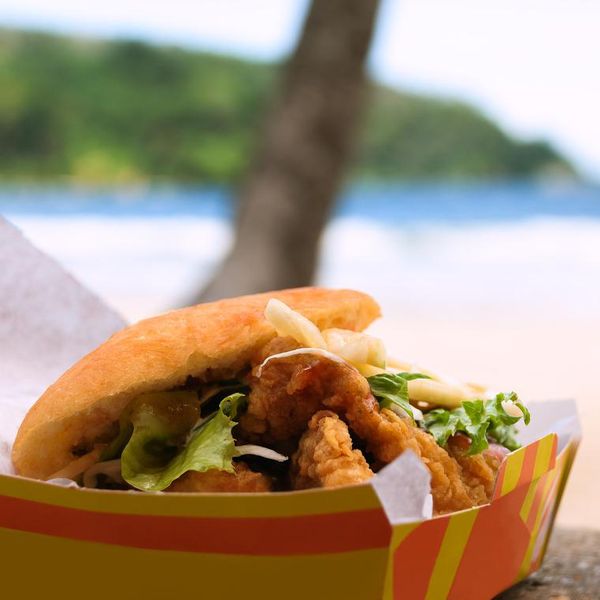 Fried shark and bake fast food outdoors by the beach at Maracas Bay in Trinidad and Tobago authentic traditional local Caribbean meal
