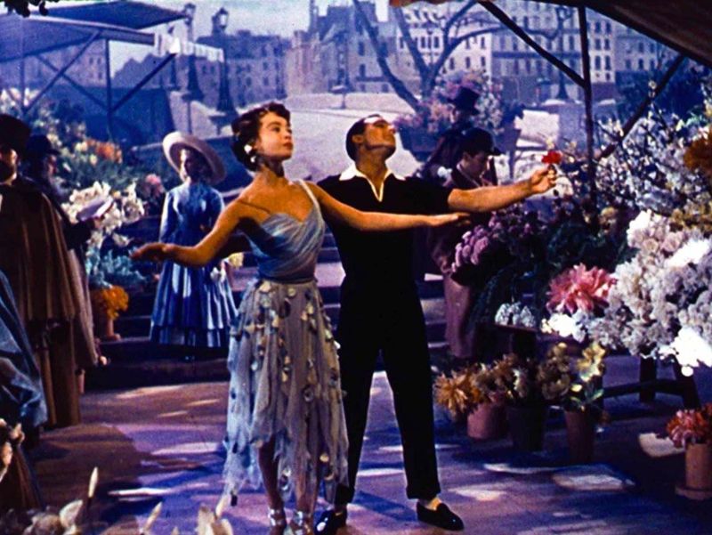 Gene Kelly and Leslie Caron dancing in An American in Paris