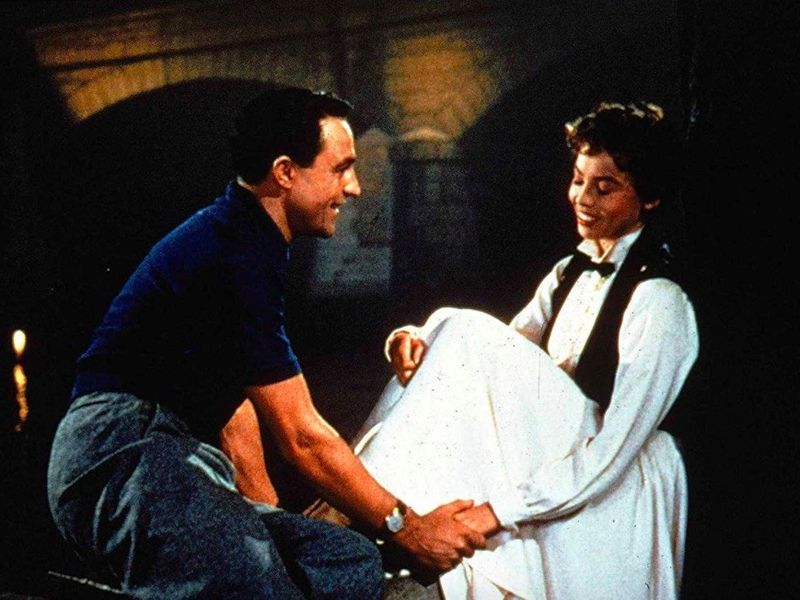 Gene Kelly and Leslie Caron interacting in An American in Paris