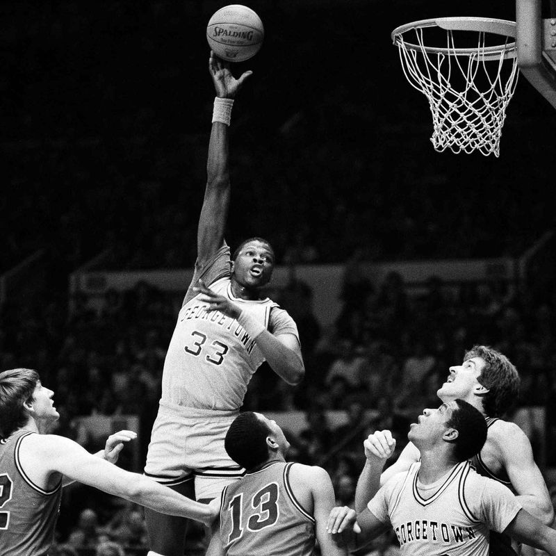 Georgetown center Patrick Ewing goes up high for shot