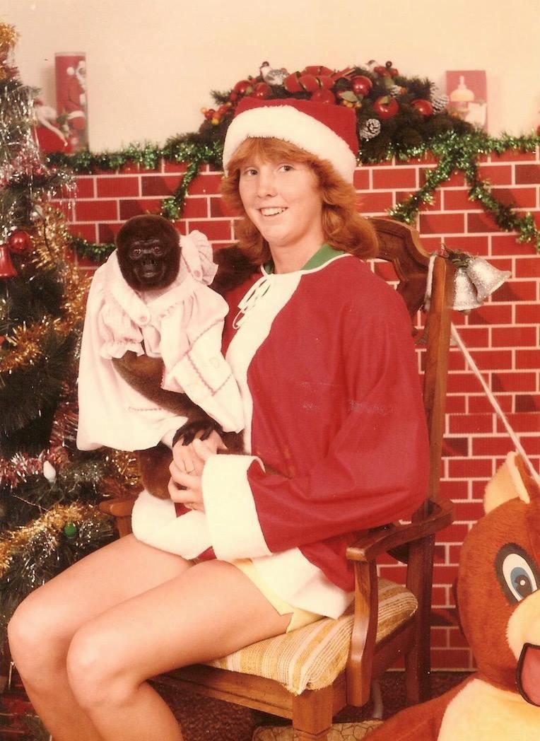Girl and monkey at Christmas time