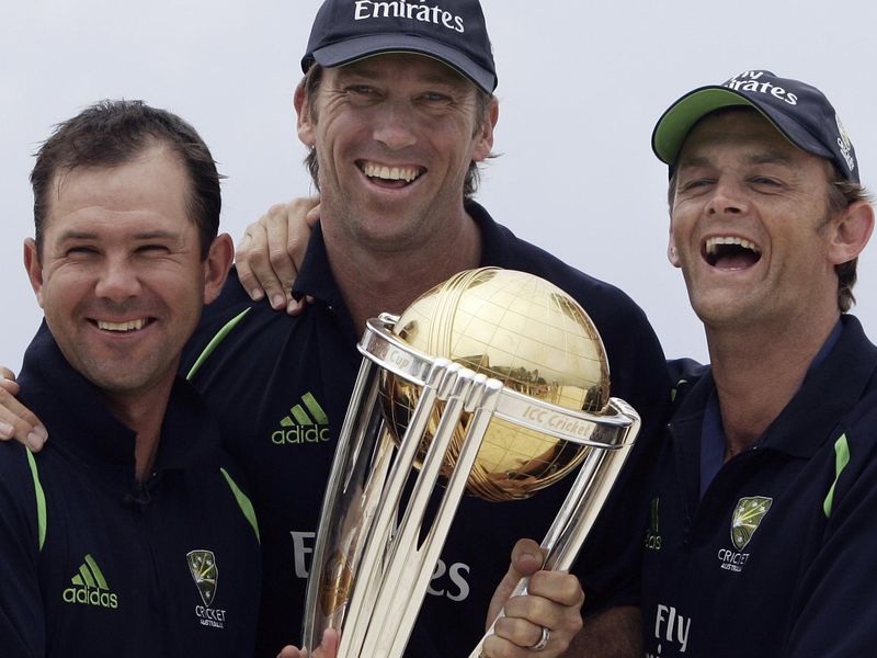 Glenn McGrath, Adam Gilchrist, and Ricky Ponting posing with trophy