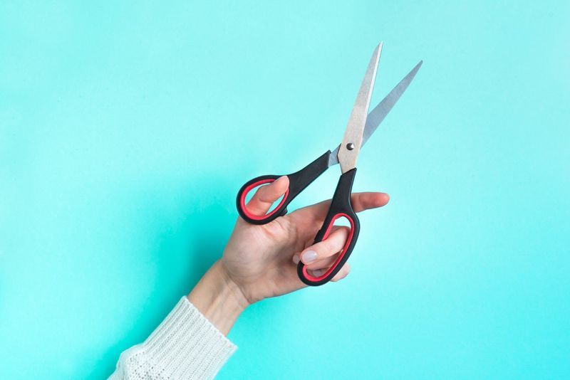 Hand-holding scissors