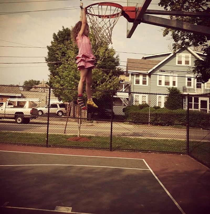 Hanging on a basketball hoop