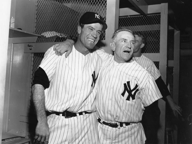 Hank Bauer hugs Yankees' manager Casey Stengel