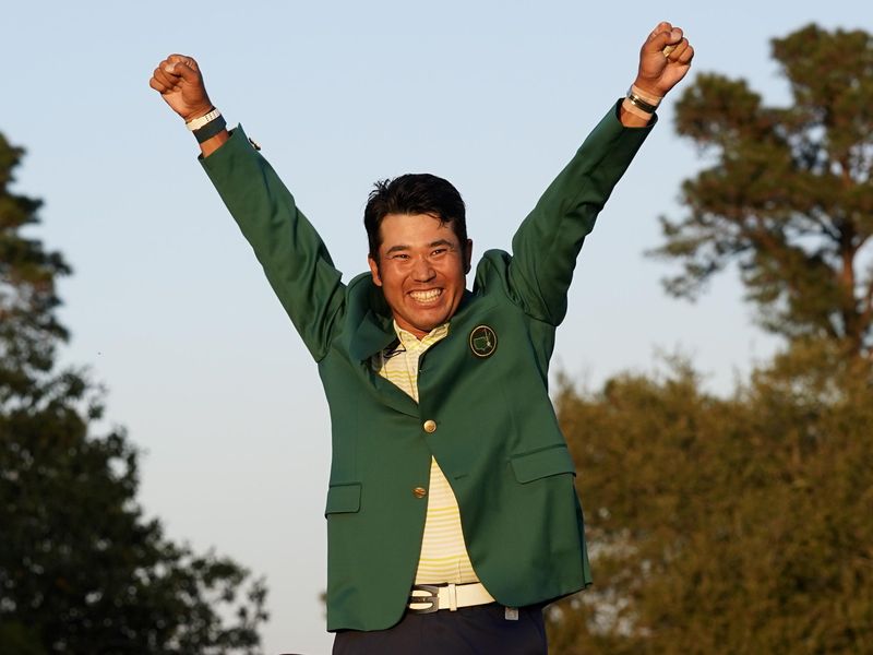Hideki Matsuyama celebrates after putting on champion's green jacket after winning Masters