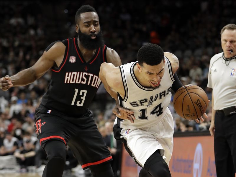 Houston Rockets' James Harden pressures as San Antonio Spurs' Danny Green moves ball