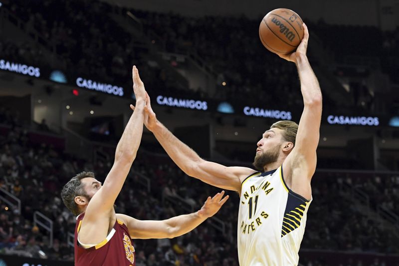 Indiana Pacers' Domantas Sabonis puts up shot against Cleveland Cavaliers' Kevin Love