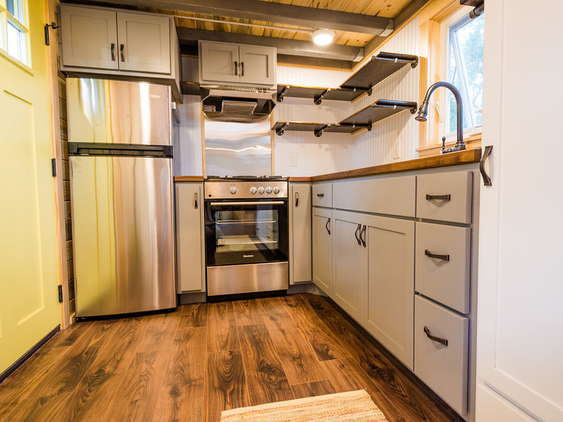 Inside compact and modern tiny house on wheels
