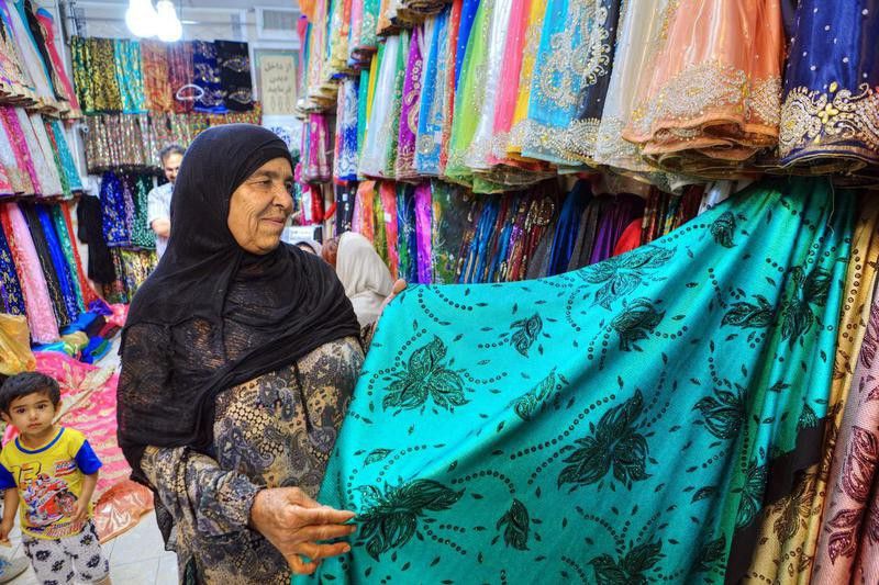 Iranian woman at a textile shop