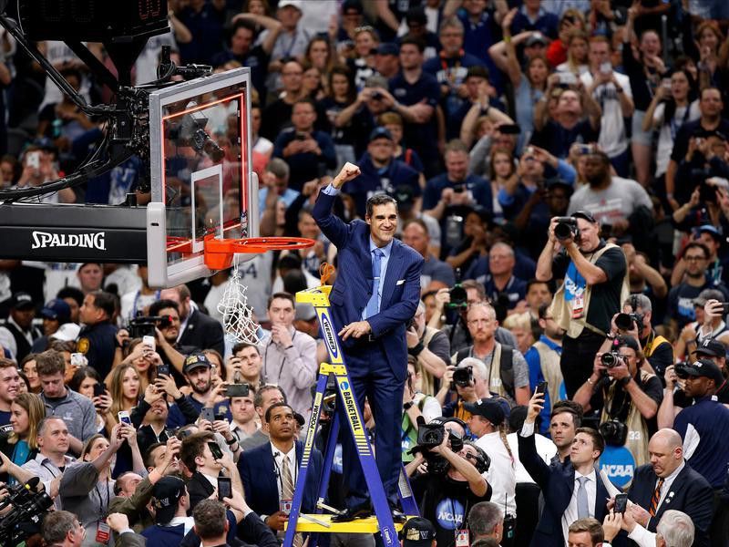 Jay Wright reacts after cutting down net