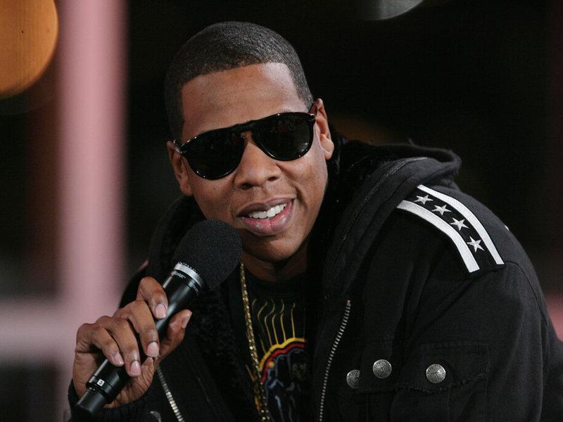 Jay-Z talks into microphone about net worth
