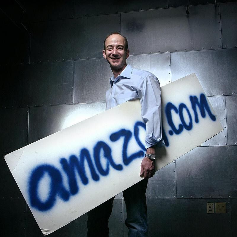 Jeff Bezos with Amazon.com sign