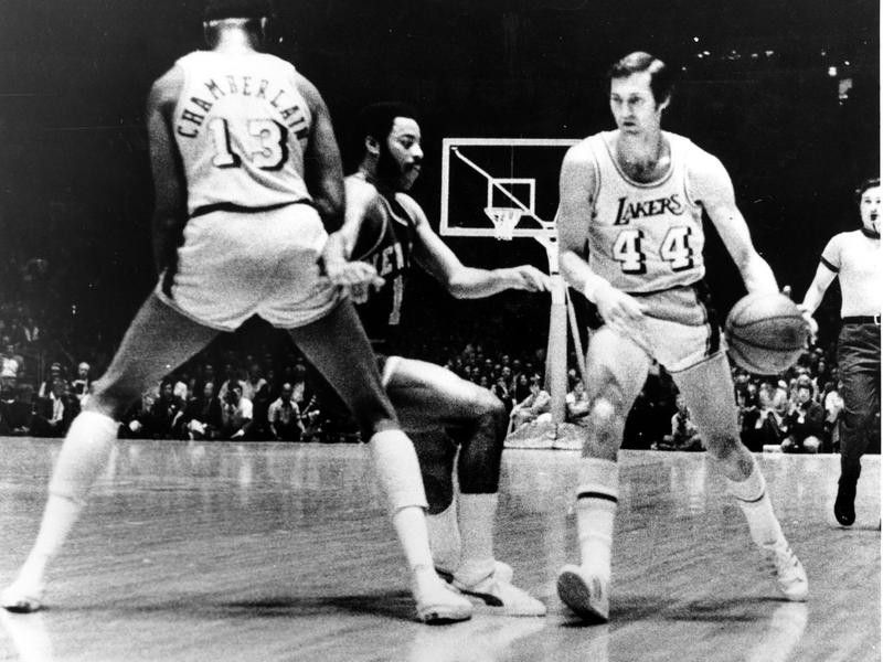 Jerry West drives around pick
