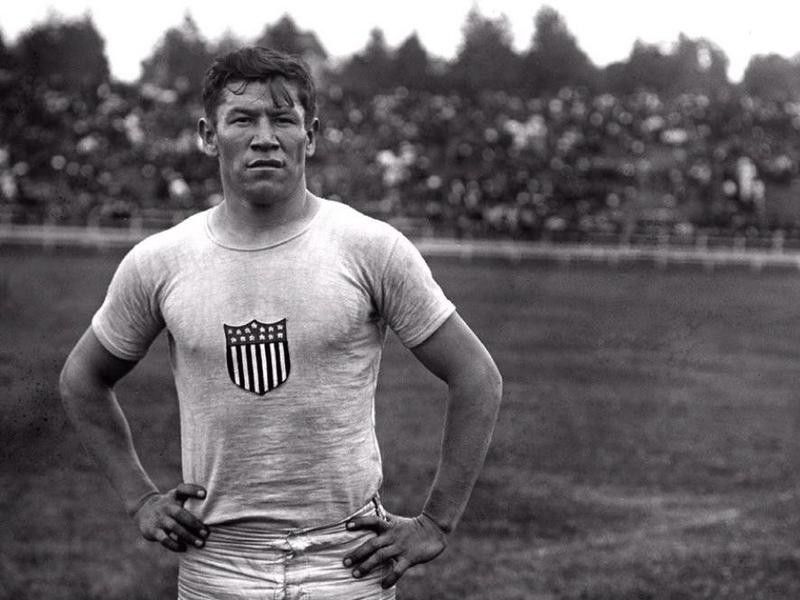 Jim Thorpe posing in Olympics shirt