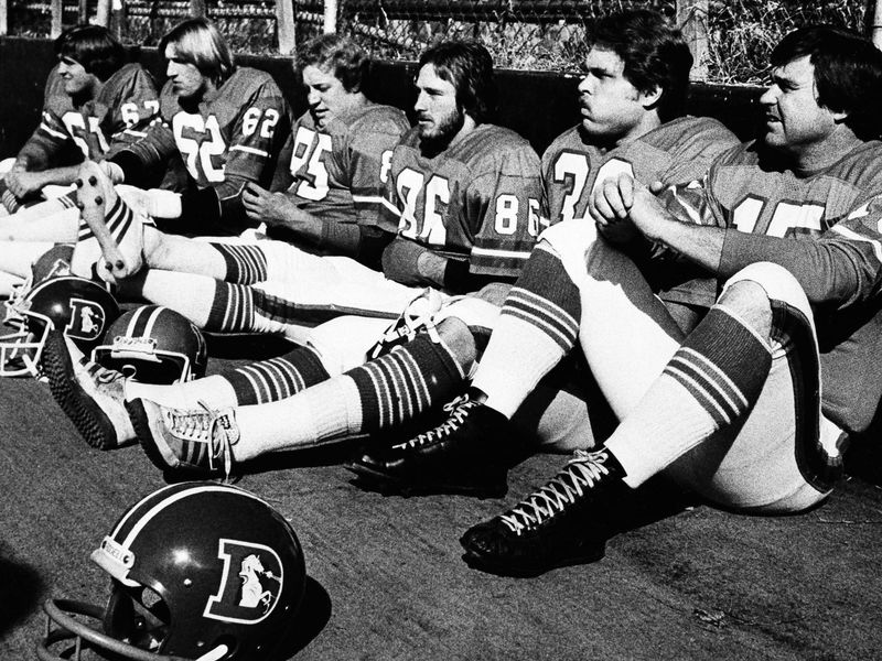 Jim Turner sitting with teammates