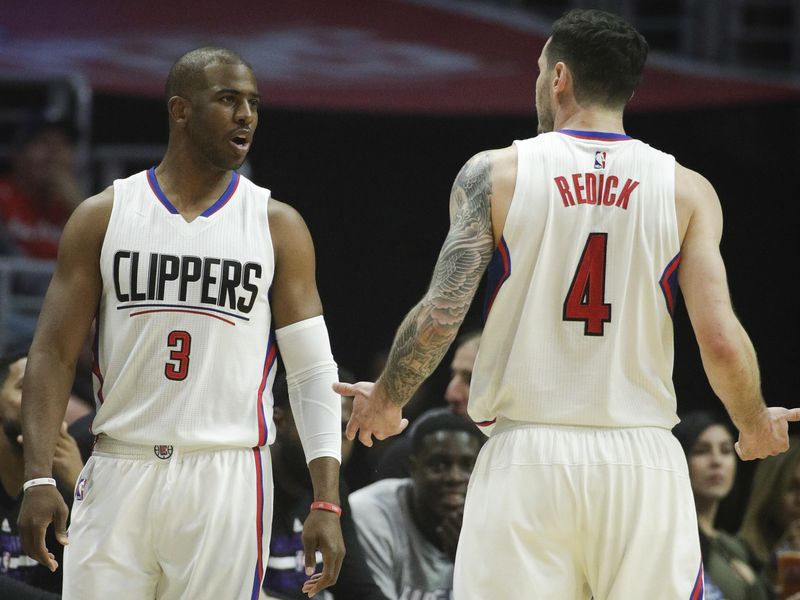 JJ Redick interacts with Chris Paul