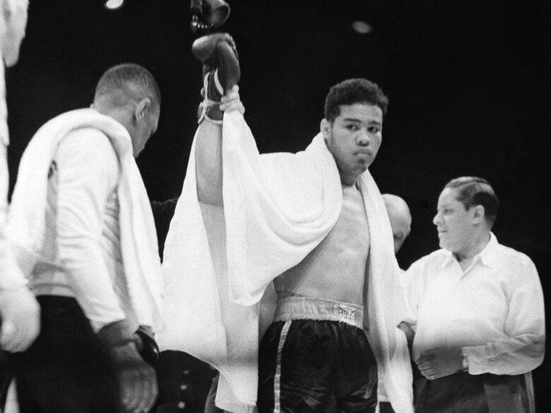 Joe Louis with arm raised in victory