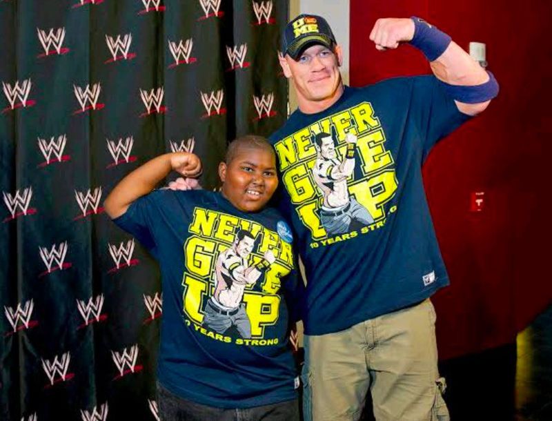 John Cena posing with little kid for Make-A-Wish