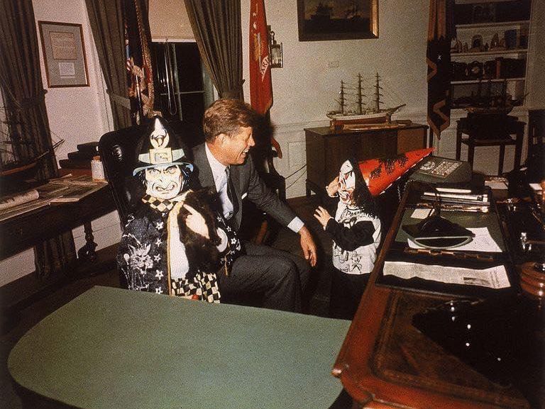 John F. Kennedy with his children Caroline and John Junior in Halloween costumes