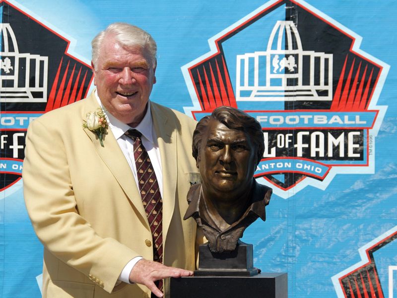 John Madden poses with Hall of Fame bust