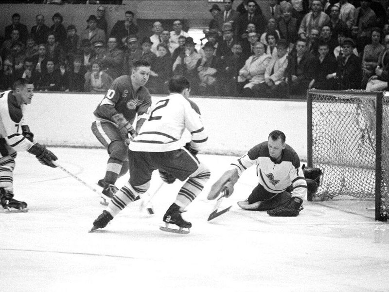 Johnny Bower protects the goal
