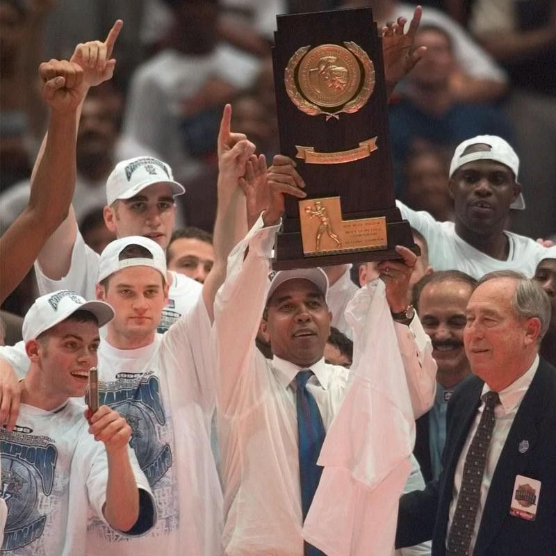 Kentucky coach Tubby Smith holds up trophy
