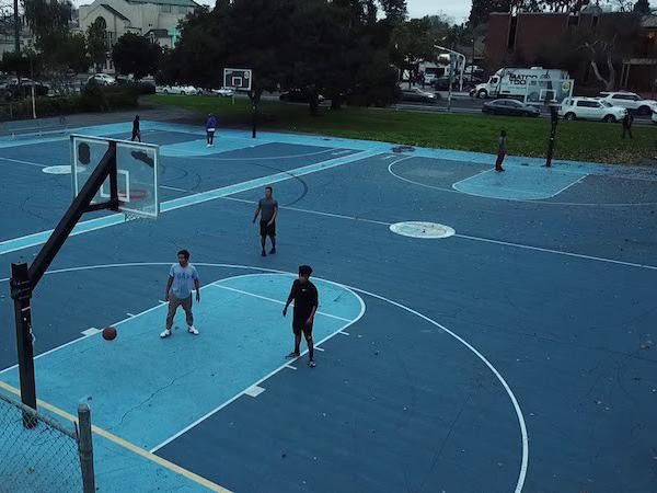 Kids playing at Mosswood Park Basketball Courts
