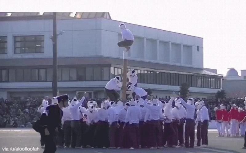 Kids playing pole toppling at schools in Japan