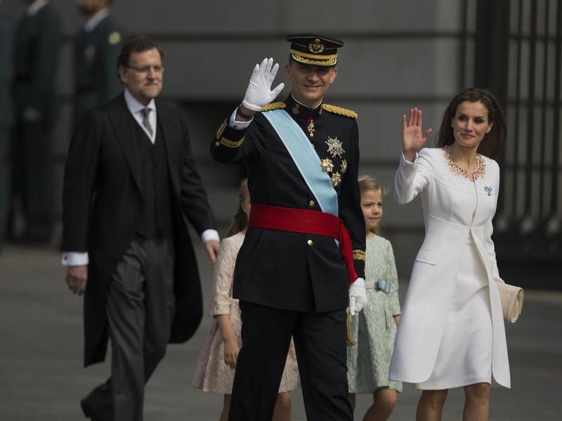 King Felipe and Queen Letizia wave