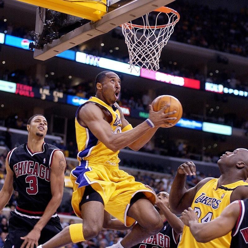 Kobe Bryant goes up for shot as Shaquille O'Neall looks on