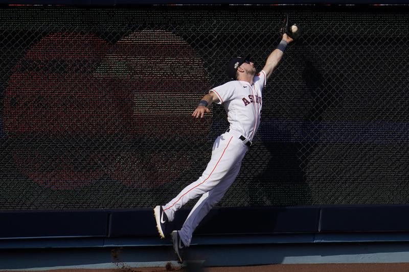 Kyle Tucker of Houston Astros catches a fly ball hit by Oakland Athletics