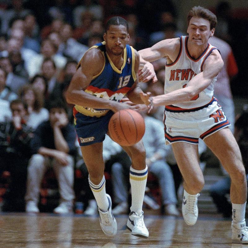 Lafayette Lever and Rick Carlisle battle for loose ball