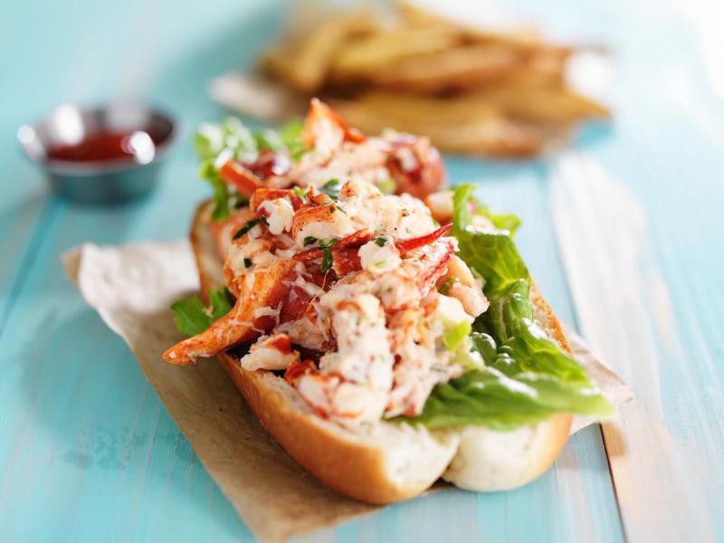 lobster roll on colorful retro painted wooden planks