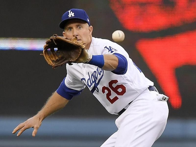 Los Angeles Dodgers second baseman Chase Utley fields ball