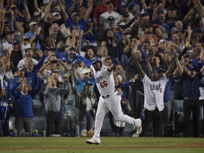 Los Angeles Dodgers' Yasiel Puig celebrates after his three-run home run