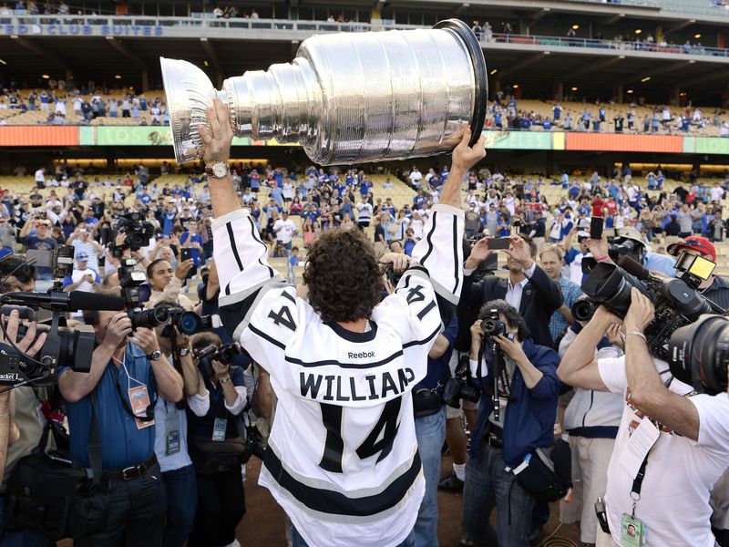 Los Angeles Kings' Justin Williams holds up Stanley Cup