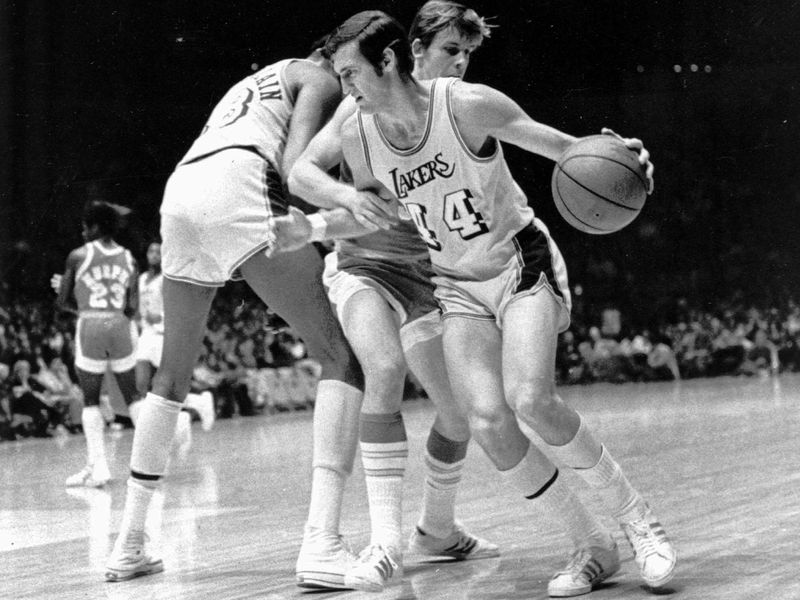 Los Angeles Lakers' Jerry West fouled as he tries to get around Houston Rockets' John Vallely
