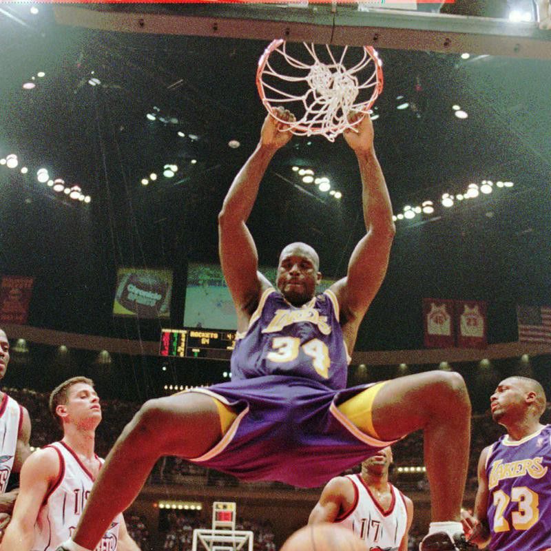 Los Angeles Lakers' Shaquille O'Neal hanging from the rim