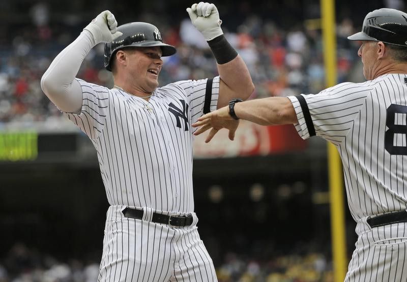 Luke Voit celebrates his home run as he rounds the bases during the first inning of a baseball game against the San Diego Padres
