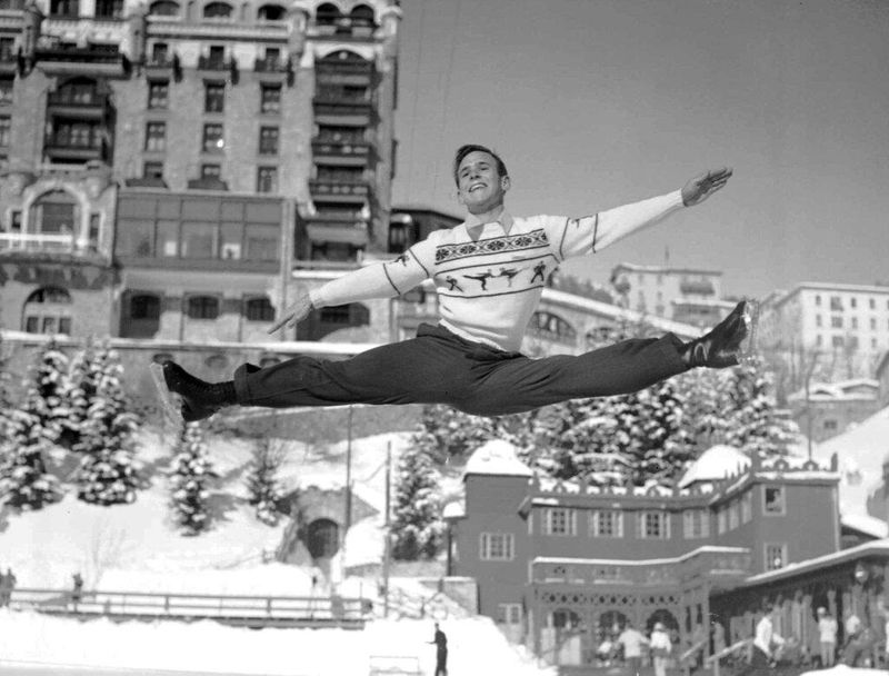 Male figure skater Dick Button leaping