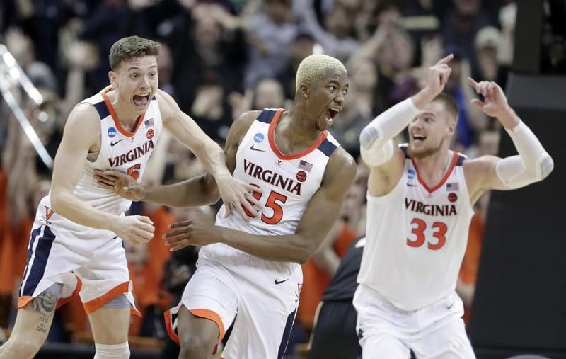 Mamadi Diakite of Virginia reacts after sending game to overtime