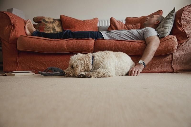 Man and his dog taking a nap