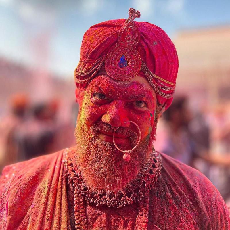 Man covered in colors during Holi