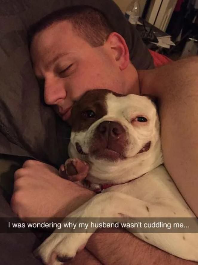 Man cuddling with dog