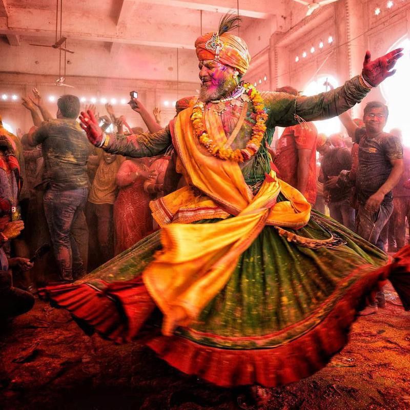Man dancing in temple during Holi