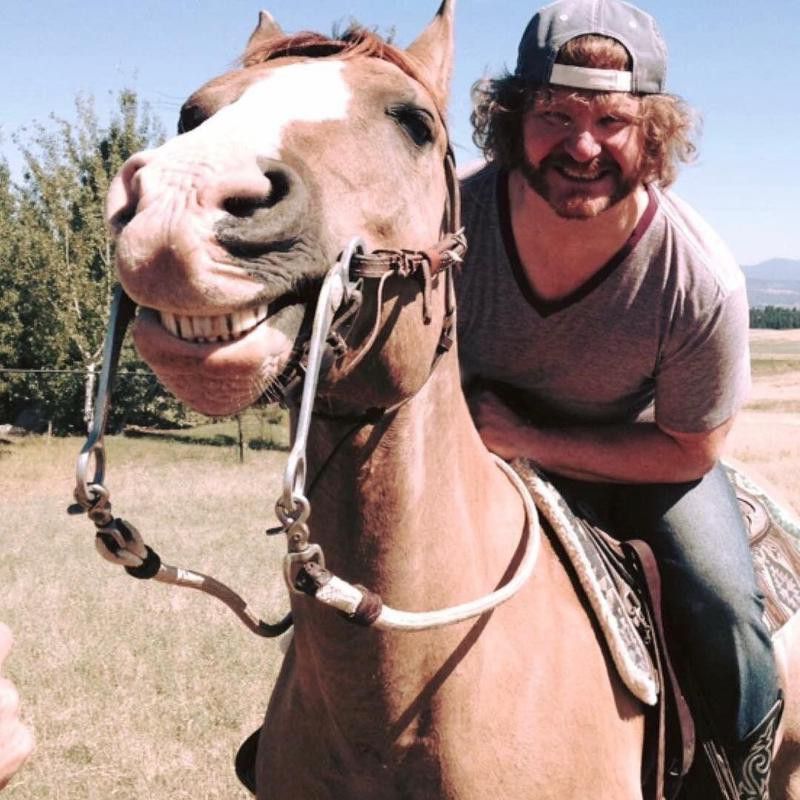 Man Riding Horse Smiling