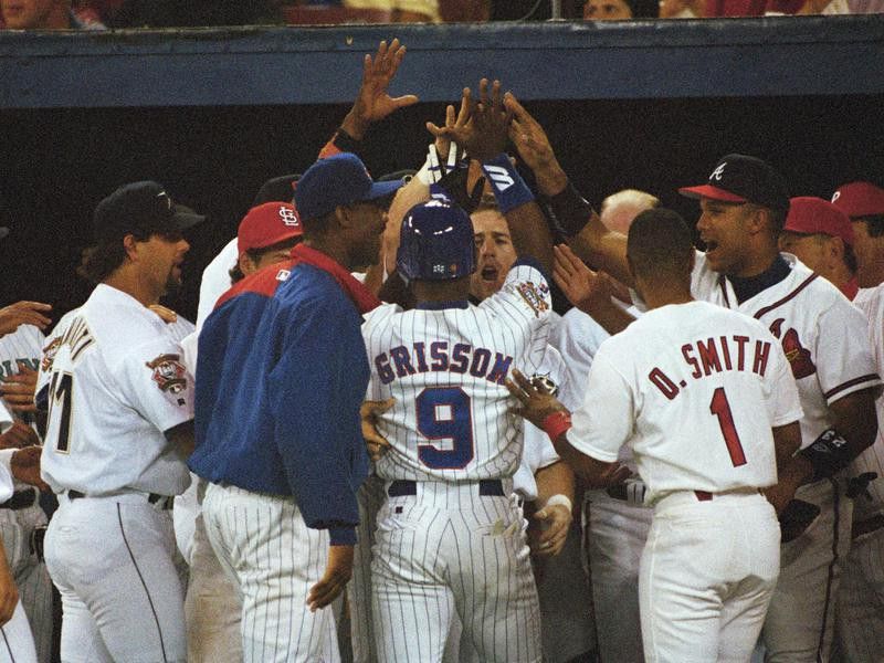Marquis Grissom is congratulated by NL All-Star teammates in 1994