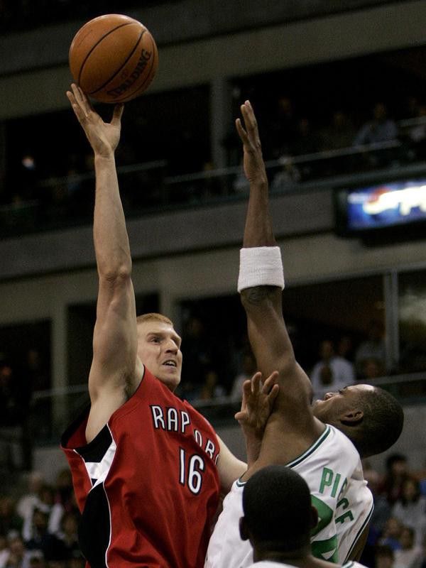 Matt Bonner shoots over Boston Celtics forward Paul Pierce