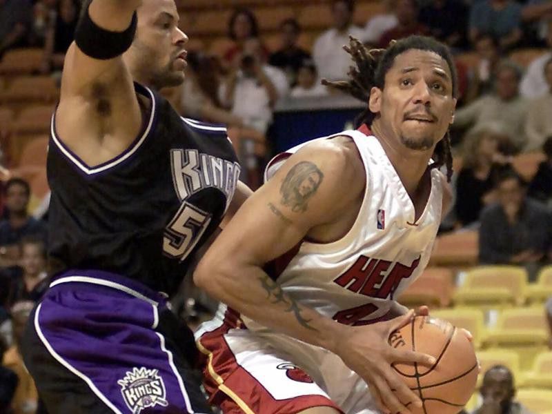 Miami Heat's Brian Grant tries to get by Sacramento Kings defender Lawrence Funderburke